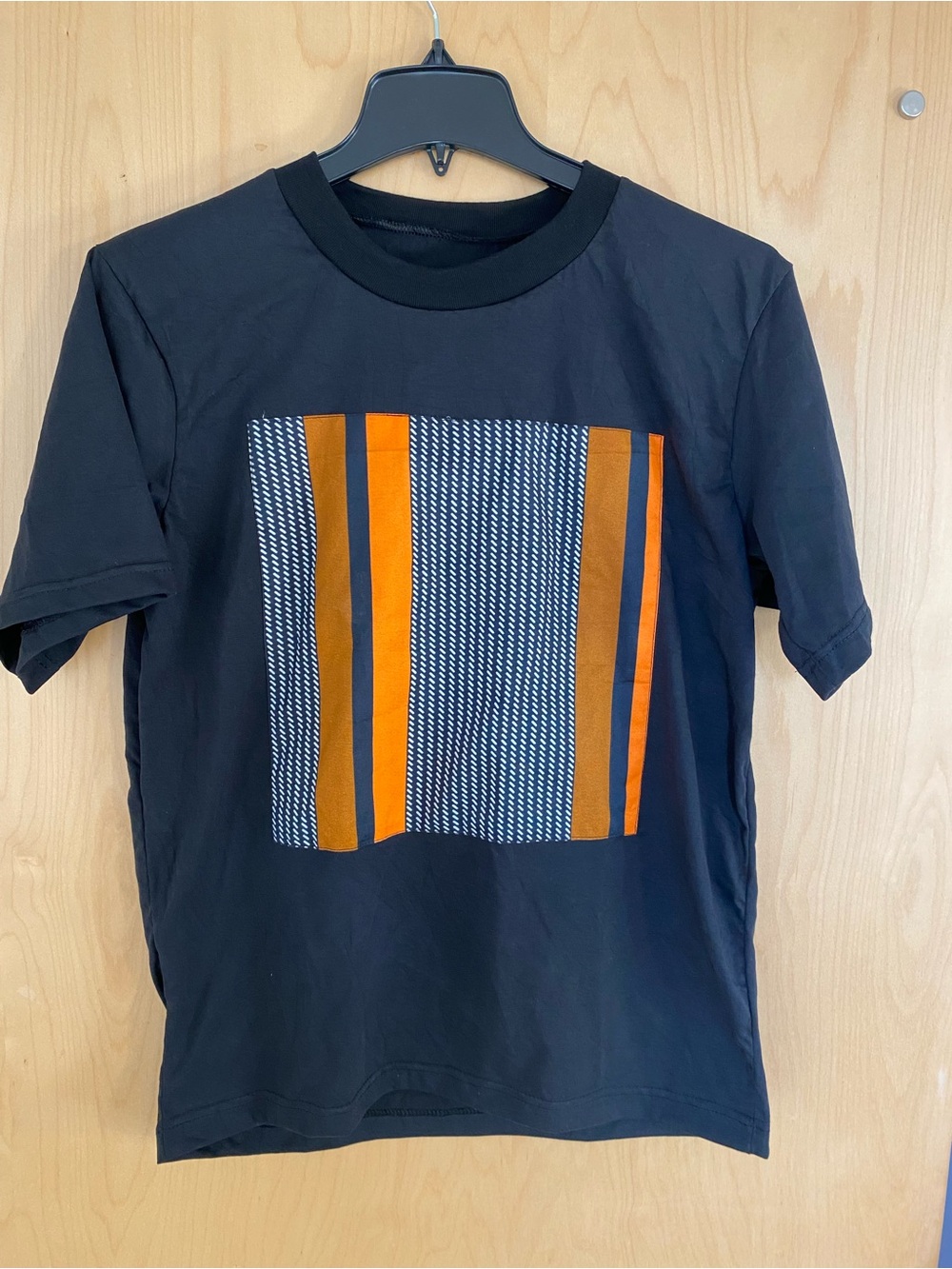 Black Unisex Tee with Bold  African print Orange & Brown Striped Panel